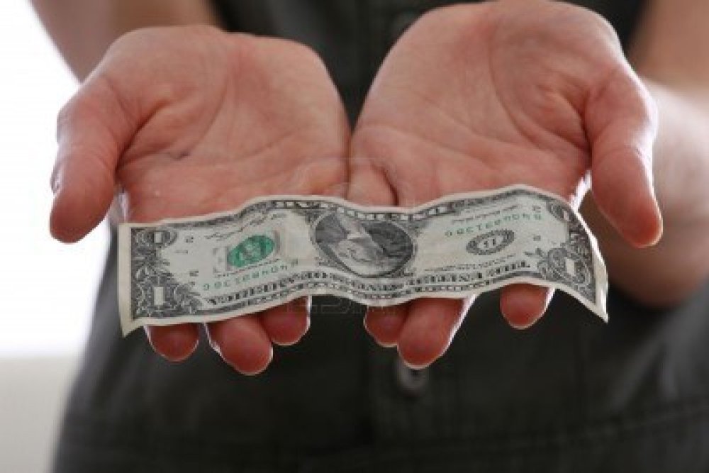 3428329-showing-wet-dollar-banknote-to-the-camera